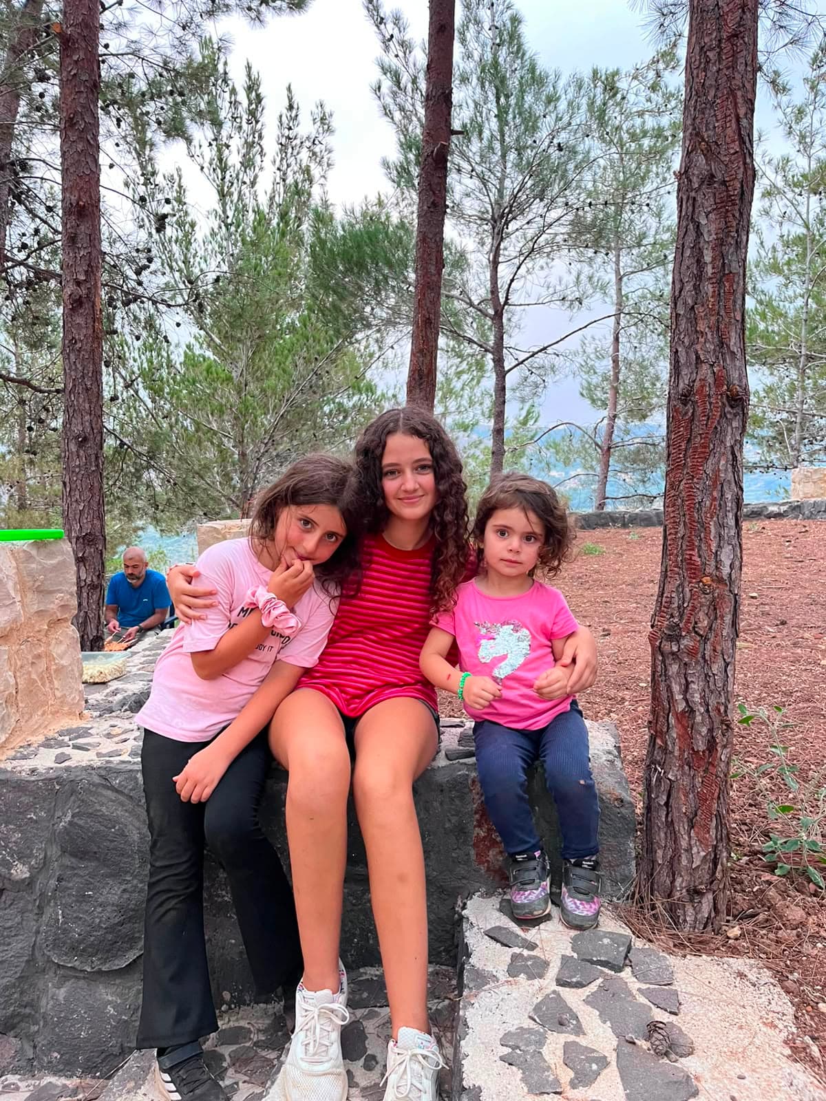 Children spending time together among the pine trees during a family camping day at Horizon Pines in Kobayat, Akkar, Lebanon.