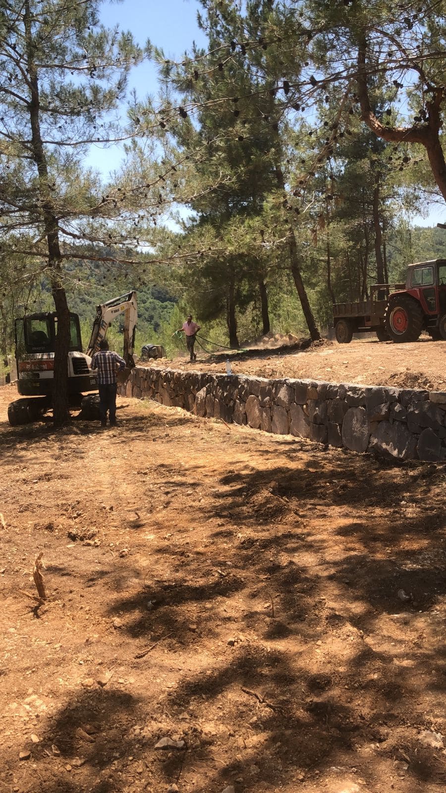 Stone retaining wall construction in progress at Horizon Pines, Lebanon