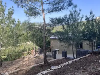 Small building by campsite path