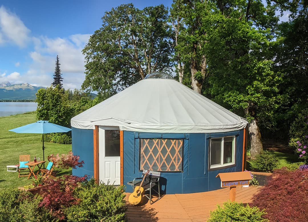 Spacious yurt interior with cozy bedding at Horizon Pines, Kobayat